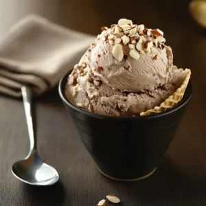 scoop of chocolate cottage cheese ice cream in cone